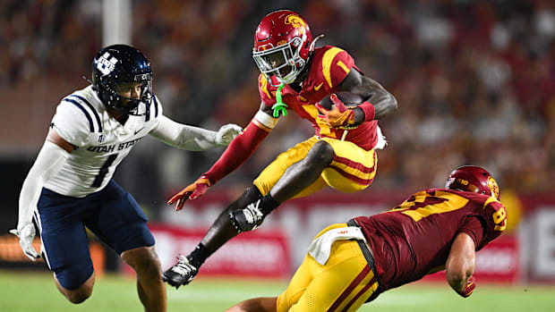 USC Trojans wide receiver Zachariah Branch (1) runs the ball against Utah State