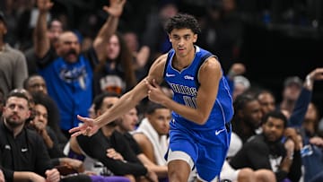 Feb 10, 2025; Dallas, Texas, USA; Dallas Mavericks guard Max Christie (00) celebrates making a three point basket during overtime against the Sacramento Kings at the American Airlines Center. Mandatory Credit: Jerome Miron-Imagn Images