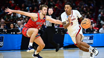 Mar 23, 2025; Cleveland, OH, USA; Alabama Crimson Tide guard Labaron Philon (0) dribbles defended by St. Mary's Gaels guard Augustas Marciulionis (3) in the first half during the NCAA Tournament Second Round at Rocket Arena. Mandatory Credit: Ken Blaze-Imagn Images