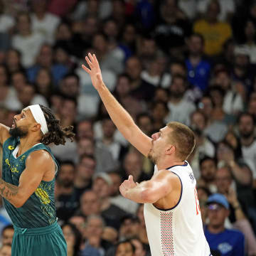 Aug 6, 2024; Paris, France; Australia guard Patty Mills (5) shoots the ball against Serbia power forward Nikola Jokic (15) during the second half in men’s basketball quarterfinals during the Paris 2024 Olympic Summer Games at Accor Arena. Mandatory Credit: Kyle Terada-USA TODAY Sports