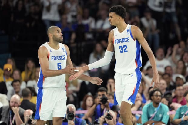 France small forward Nicolas Batum and power forward Victor Wembanyama celebrate during the second half against Germany. 