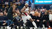 Nov 21, 2025; San Francisco, California, USA; Portland Trail Blazers forward Jerami Grant (9) drives to the basket against Golden State Warriors forward Jimmy Butler III (10) during the first quarter at Chase Center. Mandatory Credit: Robert Edwards-Imagn Images