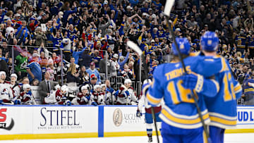 Apr 5, 2025; St. Louis, Missouri, USA;  Fans celebrate after St. Louis Blues center Robert Thomas (18) scored an empty net goal against the Colorado Avalanche at Enterprise Center. The Blues would go on to defeat the Avalanche and record a franchise record 12th straight win. Mandatory Credit: Jeff Curry-Imagn Images