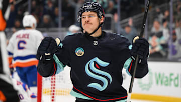 Nov 16, 2024; Seattle, Washington, USA; Seattle Kraken center Yanni Gourde (37) celebrates after scoring a goal against the New York Islanders during the first period at Climate Pledge Arena. Mandatory Credit: Steven Bisig-Imagn Images