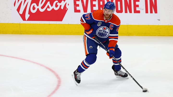 Jun 15, 2024; Edmonton, Alberta, CAN; Edmonton Oilers center Connor McDavid (97) skates with the puck in the first period against the Florida Panthers in game four of the 2024 Stanley Cup Final at Rogers Place. Mandatory Credit: Sergei Belski-Imagn Images