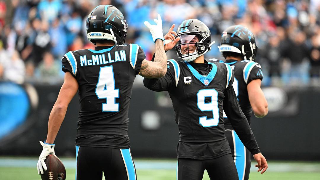 Carolina Panthers quarterback Bryce Young (9) celebrates with wide receiver Tetairoa McMillan 