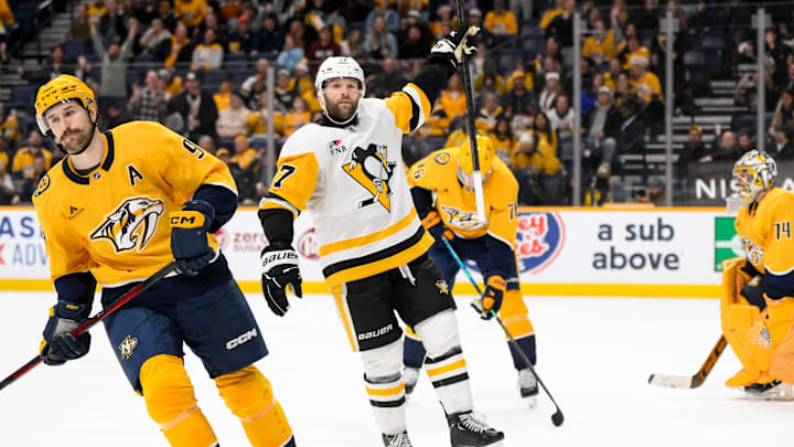 Dec 19, 2024; Nashville, Tennessee, USA; Pittsburgh Penguins right wing Bryan Rust (17) celebrates the game winner against the Nashville Predators during the 1st overtime period at Bridgestone Arena. Mandatory Credit: Steve Roberts-Imagn Images Dec 19, 2024; Nashville, Tennessee, USA; Pittsburgh Penguins right wing Bryan Rust (17) celebrates the game winner against the Nashville Predators during the 1st overtime period at Bridgestone Arena. Mandatory Credit: Steve Roberts-Imagn Images
