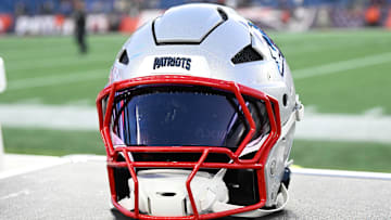 Nov 17, 2024; Foxborough, Massachusetts, USA; A New England Patriots helmet sit on an equipment case after a game against the Los Angeles Rams at Gillette Stadium. Mandatory Credit: Eric Canha-Imagn Images