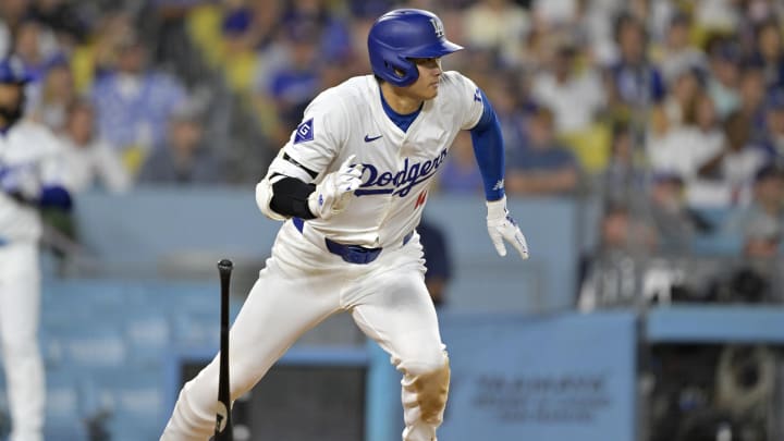 Jun 21, 2024; Los Angeles, California, USA;  Los Angeles Dodgers designated hitter Shohei Ohtani (17) runs out an infield hit in the eighth inning against the Los Angeles Angels at Dodger Stadium.