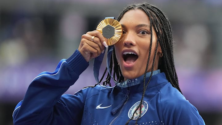 Aug 9, 2024; Saint-Denis, FRANCE; Gold medalist Tara Davis-Woodhall (USA) celebrates during the medal ceremony for the women's long jump during the Paris 2024 Olympic Summer Games at Stade de France. 