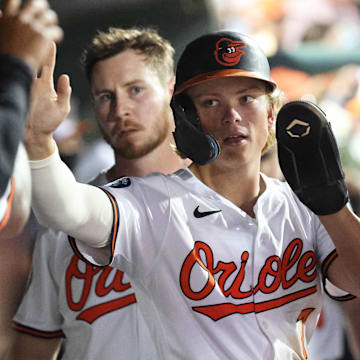 Mar 14, 2025; Sarasota, Florida, USA;  Baltimore Orioles second base Jackson Holliday (7) is congratulated  in the dugout after he scored a run during the fifth inning against the Minnesota Twins at Ed Smith Stadium.