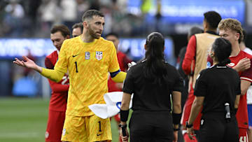 Mar 23, 2025; Inglewood, California, USA; United States of America goalkeeper Matt Turner (1) talks with FIFA referee Katia Itzel Garcia after their loss to Canada in the Concacaf Nations League third place match at SoFi Stadium. Mandatory Credit: Alex Gallardo-Imagn Images