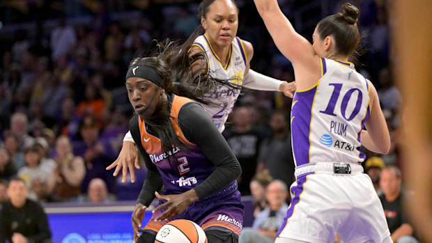 A photo of Kahleah Copper dribbling against the Spark
