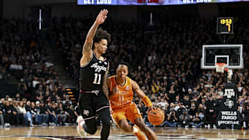 Feb 22, 2025; College Station, Texas, USA; Tennessee Volunteers guard Jordan Gainey (11) drives against Texas A&M Aggies forward Andersson Garcia (11) during the second half at Reed Arena. Mandatory Credit: Maria Lysaker-Imagn Images 