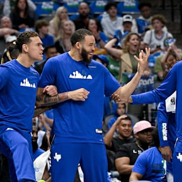 Apr 9, 2023; Dallas, Texas, USA; Dallas Mavericks forward Tim Hardaway Jr. (11) and center Dwight Powell (7) and center JaVale McGee (00) and forward Christian Wood (35) celebrate on the team bench during the second quarter against the San Antonio Spurs at the American Airlines Center. Mandatory Credit: Jerome Miron-Imagn Images