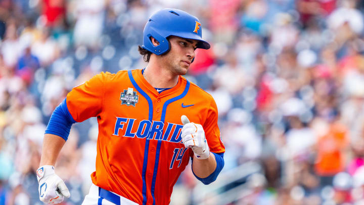 Jun 17, 2024; Omaha, NE, USA; Florida Gators starting pitcher Jac Caglianone (14) runs the bases after hitting a three-run home run against the NC State Wolfpack during the second inning at Charles Schwab Field Omaha. Mandatory Credit: Dylan Widger-USA TODAY Sports