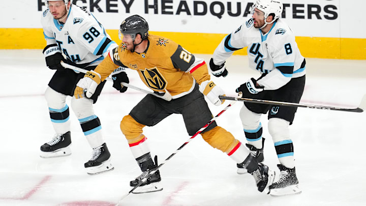 Apr 29, 2026; Las Vegas, Nevada, USA; Vegas Golden Knights center Nic Dowd (26) skates between Utah Mammoth defenseman Mikhail Sergachev (98) and center Nick Schmaltz (8) during the first overtime of game five of the first round of the 2026 Stanley Cup Playoffs at T-Mobile Arena. Mandatory Credit: Stephen R. Sylvanie-Imagn Images