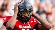 Sep 27, 2025; Raleigh, North Carolina, USA;  North Carolina State Wolfpack quarterback CJ Bailey (11) warms up during the warmups of the game against Virginia Tech Hokies at Carter-Finley Stadium. Mandatory Credit: Jaylynn Nash-Imagn Images
