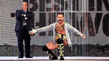 Paul Heyman accompanies CM Punk to ring. Punk cashed in the favor that Heyman owed him at a recent Smackdown event.