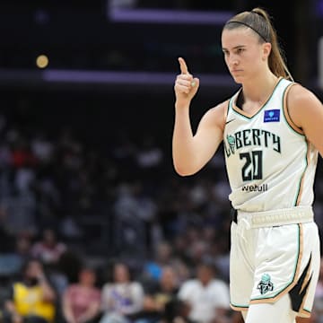 Aug 28, 2024; Los Angeles, California, USA; New York Liberty guard Sabrina Ionescu (20) gestures against the LA Sparks in the first half at Crypto.com Arena. Mandatory Credit: Kirby Lee-Imagn Images