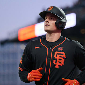 San Francisco Giants infielder Matt Chapman runs to the dugout after scoring a run against the Miami Marlins during the sixth inning at Oracle Park on Aug 31.