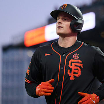 Aug 31, 2024; San Francisco, California, USA; San Francisco Giants infielder Matt Chapman runs to the dugout after scoring a run against the Miami Marlins during the sixth inning at Oracle Park. Mandatory Credit: Robert Edwards-Imagn Images