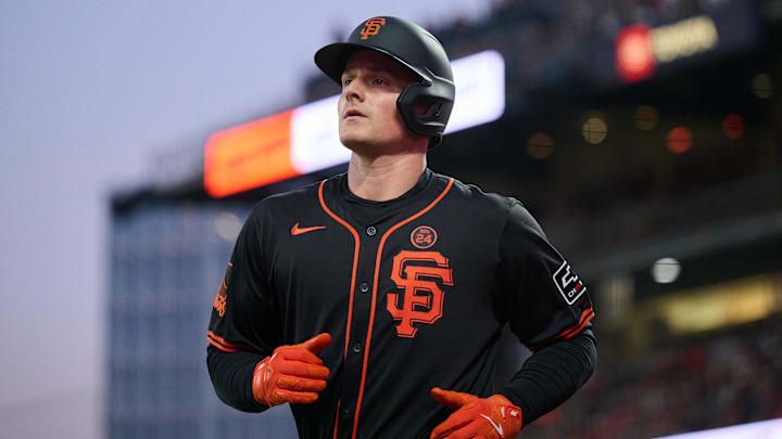 Aug 31, 2024; San Francisco, California, USA; San Francisco Giants infielder Matt Chapman runs to the dugout after scoring a run against the Miami Marlins during the sixth inning at Oracle Park. Mandatory Credit: Robert Edwards-Imagn Images