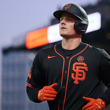 Aug 31, 2024; San Francisco, California, USA; San Francisco Giants infielder Matt Chapman runs to the dugout after scoring a run against the Miami Marlins during the sixth inning at Oracle Park.