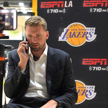 Aug 2, 2025; El Segundo, CA, USA; Los Angeles Lakers Luka Doncic (77) is interviewed by ESPN LA radio following a press conference announcing the signing of a 3-year, $165 million contract extension at UCLA Health Training Center. Mandatory Credit: Jayne Kamin-Oncea-Imagn Images