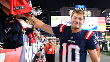 Aug 8, 2025; Foxborough, Massachusetts, USA; New England Patriots quarterback Drake Maye (10) signs autographs after a game against the Washington Commanders during the second half at Gillette Stadium. Mandatory Credit: Brian Fluharty-Imagn Images