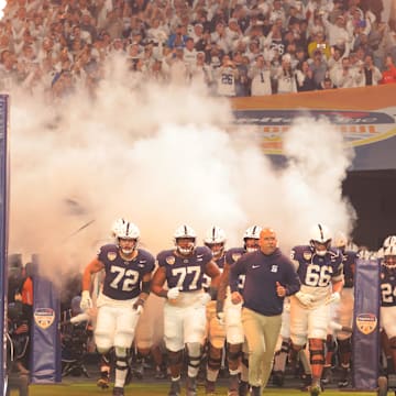 Penn State Nittany Lions head coach James Franklin leads the team out before the game against the Notre Dame Fighting Irish in the Orange Bowl at Hard Rock Stadium. 