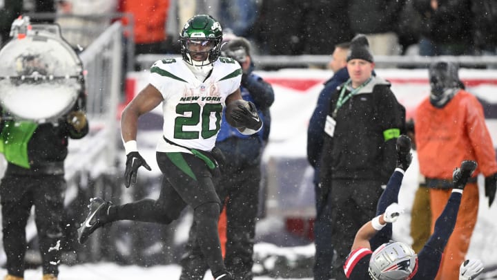 Jan 7, 2024; Foxborough, Massachusetts, USA; New York Jets running back Breece Hall (20) runs for a touchdown against the New England Patriots during the second half at Gillette Stadium. Mandatory Credit: Brian Fluharty-USA TODAY Sports