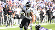 Oct 5, 2025; Baltimore, Maryland, USA; Houston Texans running back Nick Chubb (21) runs for a gain past Baltimore Ravens cornerback Keyon Martin (38) during the third quarter at M&T Bank Stadium. Mandatory Credit: Rafael Suanes-Imagn Images