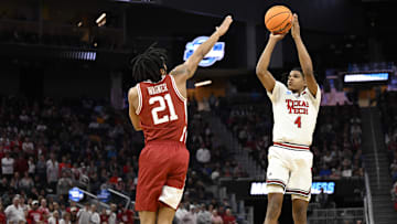 Mar 27, 2025; San Francisco, CA, USA; Texas Tech Red Raiders guard Christian Anderson (4) shoots over Arkansas Razorbacks guard D.J. Wagner (21) during the second half during a West Regional semifinal of the 2025 NCAA tournament at Chase Center. Mandatory Credit: Eakin Howard-Imagn Images