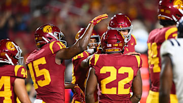 Sep 7, 2024; Los Angeles, California, USA; USC Trojans running back A'Marion Peterson (22) celebrates with teammates after scoring a touchdown against the Utah State Aggies during the fourth quarter at United Airlines Field at Los Angeles Memorial Coliseum. Mandatory Credit: Jonathan Hui-Imagn Images