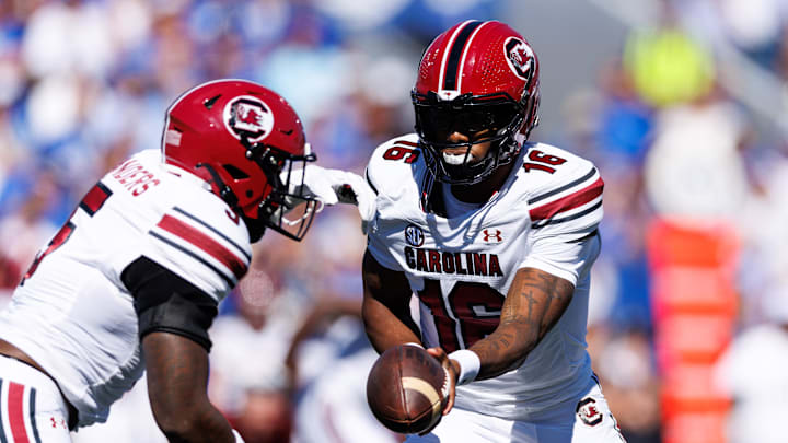 Sep 7, 2024; Lexington, Kentucky, USA; South Carolina Gamecocks quarterback LaNorris Sellers (16) hands the ball off to South Carolina Gamecocks running back Raheim Sanders (5) during the first quarter against the Kentucky Wildcats at Kroger Field. Mandatory Credit: Jordan Prather-Imagn Images