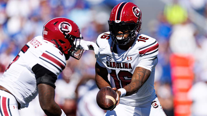 Sep 7, 2024; Lexington, Kentucky, USA; South Carolina Gamecocks quarterback LaNorris Sellers (16) hands the ball off to South Carolina Gamecocks running back Raheim Sanders (5) during the first quarter against the Kentucky Wildcats at Kroger Field. Mandatory Credit: Jordan Prather-Imagn Images