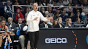 Mar 29, 2024; Albany, NY, USA; Oregon State Beavers head coach Scott Rueck speaks to his players on the court during the first half in the semifinals of the Albany Regional of the 2024 NCAA Tournament at the MVP Arena at MVP Arena. Mandatory Credit: Gregory Fisher-Imagn Images