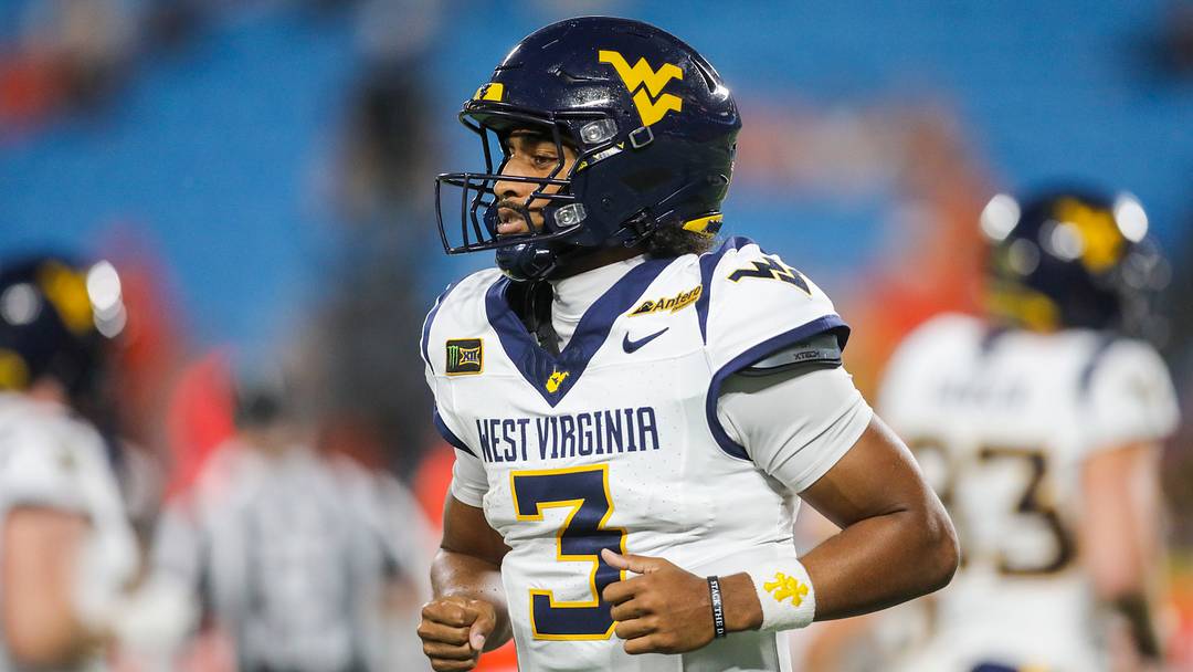 Sep 19, 2026; Charlotte, North Carolina, USA; West Virginia Mountaineers quarterback Michael Hawkins Jr. (3) runs off the field after a series during the first quarter against the Virginia Cavaliers at Bank of America Stadium. Mandatory Credit: Ben Queen-Imagn Images