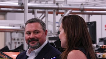 Texas Tech University System Board of Regents Chairman Cody Campbell listens to U.S. Department of Agriculture Secretary Brooke Rollins speak to other Texas Tech leaders at the USDA Agricultural Marketing Service Cotton Classification Complex on April 16, 2025