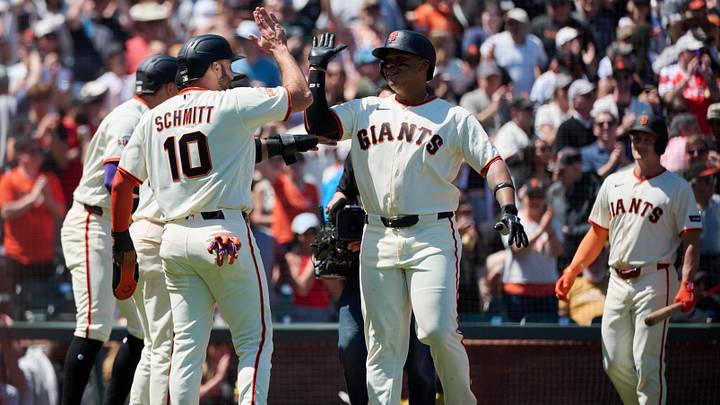 May 24, 2026; San Francisco, California, USA; San Francisco Giants designated hitter Rafael Devers (16) celebrates with infielders Casey Schmitt (10), Luis Arraez (1) and Willy Adames (2) after hitting a grand slam home run against Chicago White Sox pitcher Grant Taylor (not pictured) during the fifth inning at Oracle Park. Mandatory Credit: Robert Edwards-Imagn Images