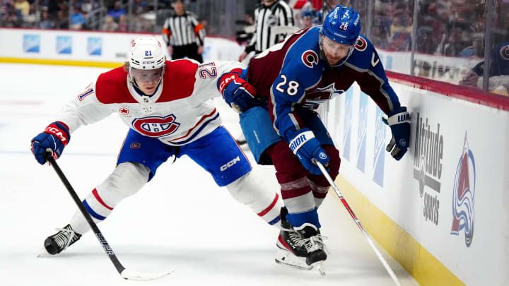 Mar 26, 2024; Denver, Colorado, USA; Montreal Canadiens defenseman Kaiden Guhle (21) and Colorado Avalanche left wing Miles Wood (28) during the second period at Ball Arena. Mandatory Credit: Ron Chenoy-USA TODAY Sports