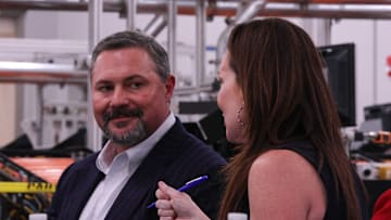 Texas Tech University System Board of Regents Chairman Cody Campbell listens to U.S. Department of Agriculture Secretary Brooke Rollins speak to other Texas Tech leaders at the USDA Agricultural Marketing Service Cotton Classification Complex on April 16, 2025
