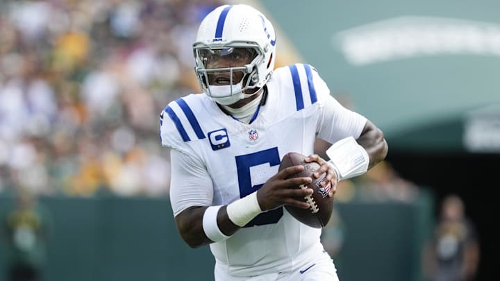 Sep 15, 2024; Green Bay, Wisconsin, USA;  Indianapolis Colts quarterback Anthony Richardson (5) scrambles with the football during the fourth quarter against the Green Bay Packers at Lambeau Field. Mandatory Credit: Jeff Hanisch-Imagn Images