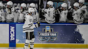 Apr 12, 2025; St. Louis, Missouri, UNITED STATES; Western Michigan Broncos forward Ty Henricks (17) is congratulated by teammates after scoring against the Boston University Terriers during the second period of the Frozen Four college ice hockey national championship at Enterprise Center. Mandatory Credit: Jeff Curry-Imagn Images