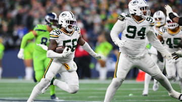 Dec 15, 2024; Seattle, Washington, USA; Green Bay Packers linebacker Edgerrin Cooper (56) carries the ball after an interception against the Seattle Seahawks during the second half at Lumen Field. Mandatory Credit: Steven Bisig-Imagn Images