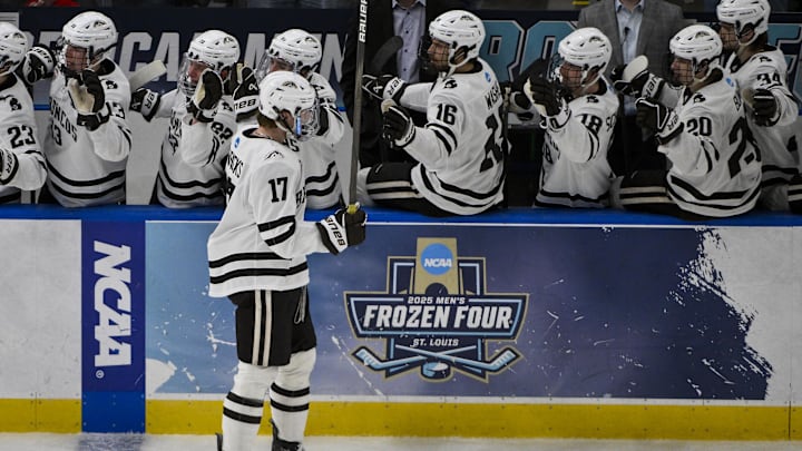 Apr 12, 2025; St. Louis, Missouri, UNITED STATES; Western Michigan Broncos forward Ty Henricks (17) is congratulated by teammates after scoring against the Boston University Terriers during the second period of the Frozen Four college ice hockey national championship at Enterprise Center. Mandatory Credit: Jeff Curry-Imagn Images