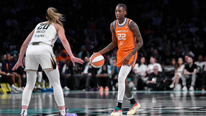 Aug 25, 2025; Brooklyn, New York, USA; Connecticut Sun guard Saniya Rivers (22) sets the play while defended by New York Liberty guard Sabrina Ionescu (20) during the second half at Barclays Center. 
