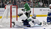 Apr 8, 2025; Dallas, Texas, USA; Dallas Stars center Matt Duchene (not pictured) scores a goal past Vancouver Canucks goaltender Thatcher Demko (35) as left wing Jamie Benn (14) looks on during the second period at the American Airlines Center. Mandatory Credit: Jerome Miron-Imagn Images