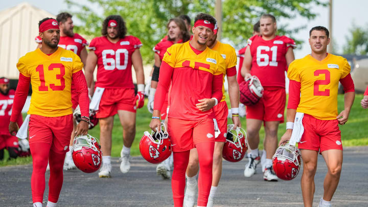 Jul 22, 2024; St. Joseph, MO, USA; Kansas City Chiefs quarterback Chris Oladokun (13) and quarterback Patrick Mahomes (15) and quarterback Carson Wentz (11) and quarterback Ian Book (2) walk down the hill from the locker room to the fields prior to training camp at Missouri Western State University. Mandatory Credit: Denny Medley-USA TODAY Sports